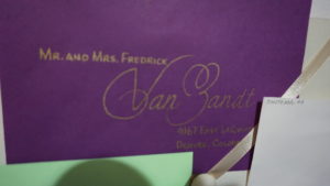 caligraphy purple with gold writing envelope